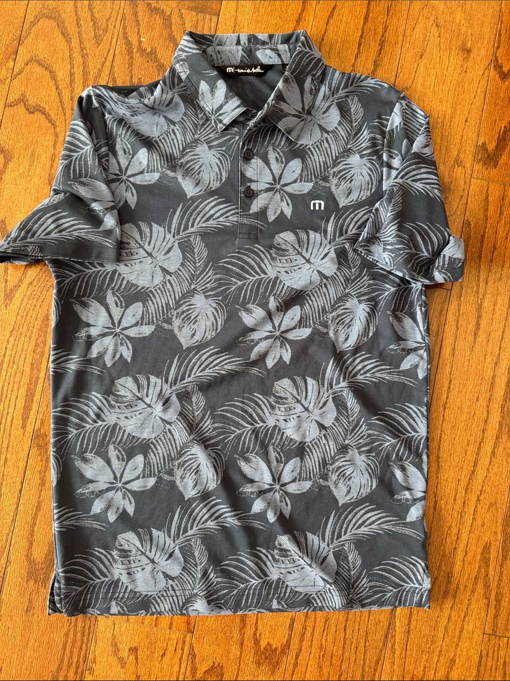 Travis Mathew Black Polo with Light Gray Tropical Print